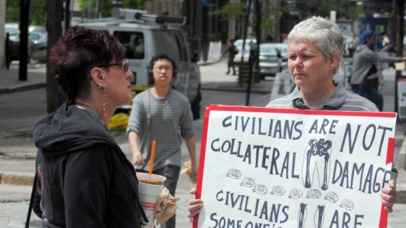 Pia Ward, an organizer with the FANG Collective, at a protest in front of Textron's corporate headquarters in Rhode Island, manufacturer of CBU-105 Sensor Fuzed Weapons. (c) Bob Plain, RI Future, May 19, 2016
